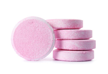 Stack of pink soluble tablets isolated on white background