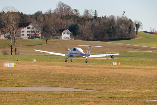 Diamond DA40 airplane on the grass runway in Lommis in Switzerland 27.2.2022