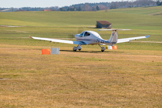 Diamond DA40 airplane on the grass runway in Lommis in Switzerland 27.2.2022