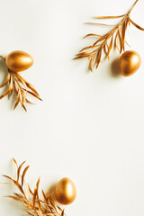 Minimal gold eggs easter concept. Stylish easter golden eggs on white background. Flat lay trendy easter. Happy easter card