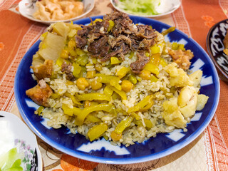 The plov in the porcelain plate.