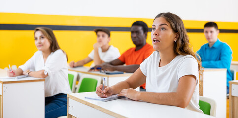 Woman in group of students in a university audience