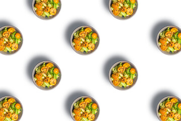 Pattern of salad bowls on white background.
