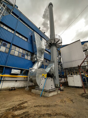 Chimney discharging fumes from a natural gas-fired boiler.