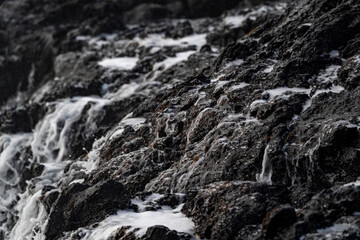 Very big waves and beautiful black rocks the power of the ocean
