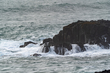 Very big waves and beautiful black rocks the power of the ocean