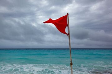 storm warning flag on the beach