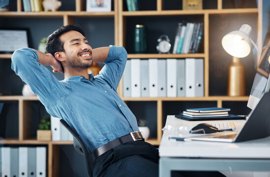 Happy business man stretching to relax from easy project, complete achievement and happiness in office. Worker, smile and hands behind head to finish tasks, rest and break for productivity at desk