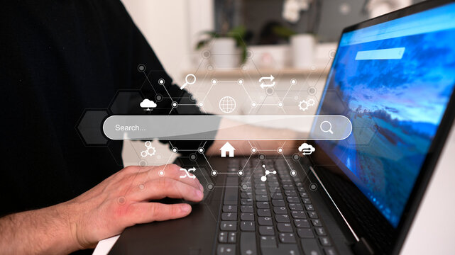 Man using laptop searching and browsing internet data information