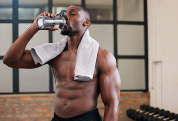 Shirtless black man, gym and water bottle for health, break and energy of workout, training and exercise diet. Thirsty male, abs and drinking for fitness nutrition, body hydration and sports wellness - obrazy, fototapety, plakaty