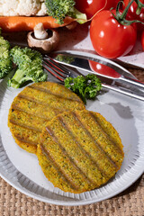 Grilled tasty vegan and vegetarian burgers made from fresh broccoli vegetables and dried legumes and beans