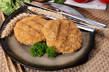 Source of fibre plant based vegan wheat protein grilled burgers, meat free healthy food close up