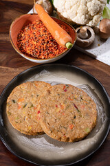 Uncooked fresh vegan and vegetarian burgers made from fresh vegetables and dried legumes and beans