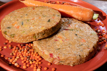 Uncooked fresh vegan and vegetarian burgers made from fresh vegetables and dried legumes and beans