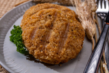 Source of fibre plant based vegan wheat protein grilled burgers, meat free healthy food close up