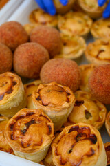 Traditional street food in UK, stuffed fried Scotch eggs with breadcrumbs and baked pie with pork meat