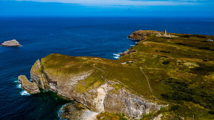 Cliffs At Atlantic Coast With Ancient Lighthouse At Cap Frehel In Brittany, France; Phare du Cap Frehel