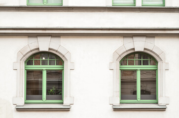 View of beautiful building with green windows