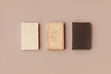 Set of natural soap bars on color background