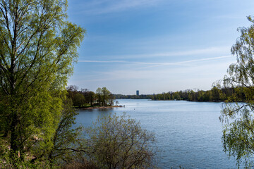 Landscape. Lake in spring, blue water and blue sky.