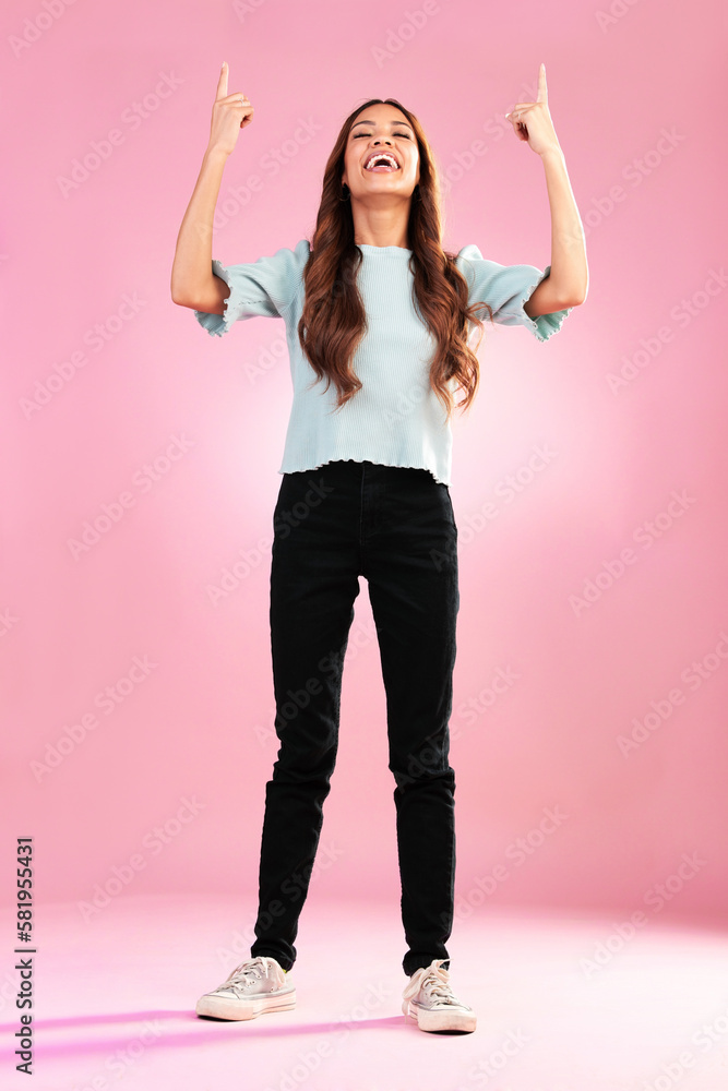 Sticker Pointing, mockup and woman in studio on pink background with happy, smile and excited for discount news. Advertising, hands and girl looking up for product placement, promotion and deal announcement