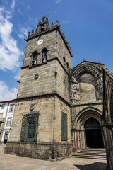 Fototapeta na wymiar Church of Our Lady of Oliveira (Nossa Senhora da Oliveira) in Guimaraes, Portugal. Nossa Senhora da Oliveira - one of the most significant examples of Gothic architecture in north of country.