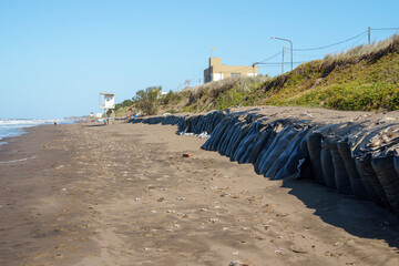 Global warming Image of a barricade built on a beach to prevent the advance of the sea on the coastal dunes