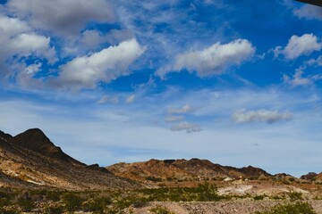 Beautiful Landscape of Mountains and Clouds in the Blue Sky somewhere in the Desert