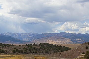 Fototapeta premium Sharp peaks rise over the Eastern Sierra, a region at the base of the steep eastern side of the Sierra Nevadas, as seen from the Travertine Hot Springs.