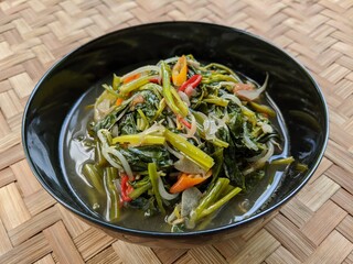 Cah kangkung or tumis kangkung, stir fried water spinach, common asian vegetable dish