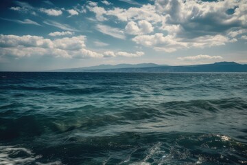Fototapeta premium View of the sea, ocean, and lovely clouds in the distance. Generative AI