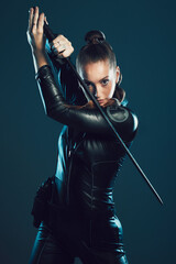 Woman, warrior and vigilante in cosplay with sword for dangerous battle, war or game against dark...