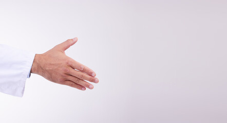 Doctor, handshake and mockup for healthcare partnership, meeting or greeting against a white studio background. Hand of isolated medical professional shaking hands for introduction, deal or thank you