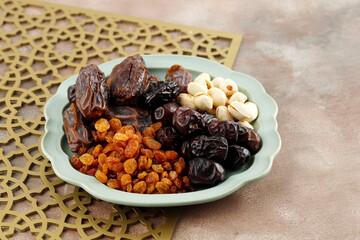 Snack for Sweet Takjil Iftar Moslem Ramadan Month, Pistachio, Dates Fruit, and Golden Raisin.