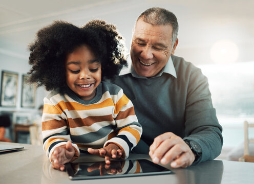 Tablet, Online Education And Child With Grandfather Bonding, Fun Internet Games And E Learning Development. Biracial, Elderly Man With Kid On Digital Technology App For Family Support And Teaching