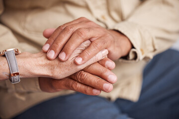 Senior couple holding hands for support, love and comfort together in retirement, cancer empathy or...