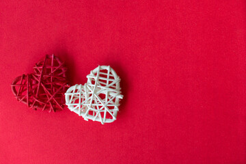 Fototapeta na wymiar A Red and White heart in a red background, Valentines day and marriage concept Selective focus