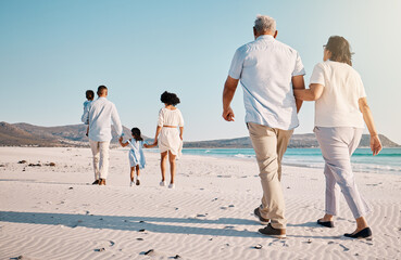 Holding hands, beach family and people walk, bond or enjoy time together for travel vacation,...