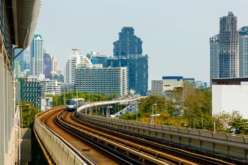 Foto auf Glas BTS Sky Train is running in downtown of Bangkok. Sky train is fastest transport mode in Bangkok  © dron285