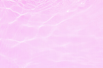Defocus blurred transparent pink colored clear calm water surface texture with splash, bubble....