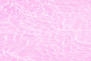 Fototapeta premium Defocus blurred transparent pink colored clear calm water surface texture with splash, bubble. Shining pink water ripple background. Surface of water in swimming pool. Pink bubble water shining.