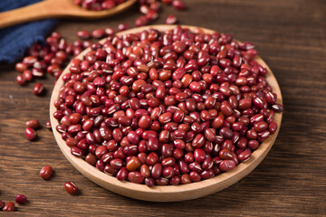 Azuki beans or red beans in wooden plate on  table