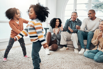 Happy family, children dancing and living room with parents, grandparents or love with applause in home. Girl kids, mom and dad with dance, smile or happiness for bonding in house together on holiday