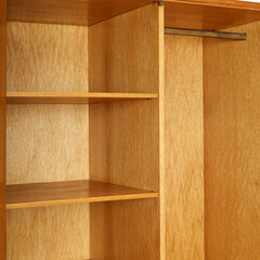Vintage 1960s oak wood armoire. Mid-Century Modern furniture. Interior view of the shelves.