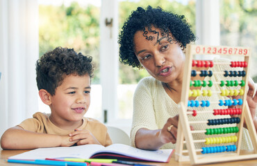 Abacus, grandmother or boy learning math kindergarten homework or school education in house. Numbers counting or serious senior woman teaching or helping a smart young boy student with development