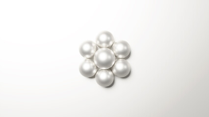 白背景に花のようなパールの飾りが置かれた背景素材。高級感のある背景素材。（横長）（俯瞰）