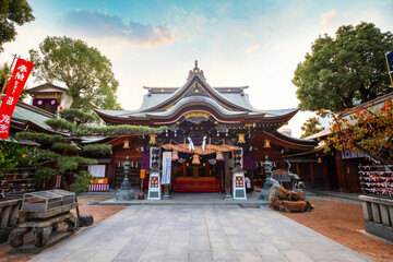 Fukuoka, Japan - Nov 20 2022: Kushida shrine in Hakata ward, founded in 757, the shrine dedicated to Amaterasu the goddess of the sun and Susanoo god of seas and storms, thunder and lightning - 581981040