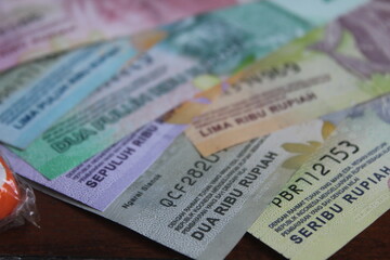 lots of rupiah bills on the table