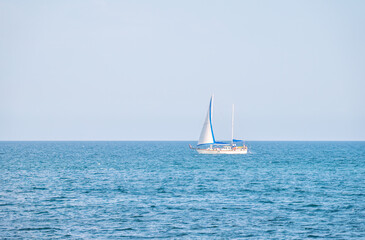 Obraz premium Sailing yacht in the blue calm sea.