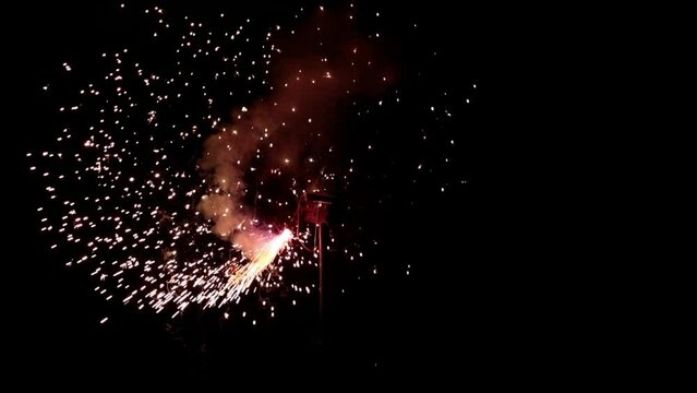 Props for the fire show. Evening show program on the street. Pyrotechnics. The spinner is a sparkler. Slow motion.